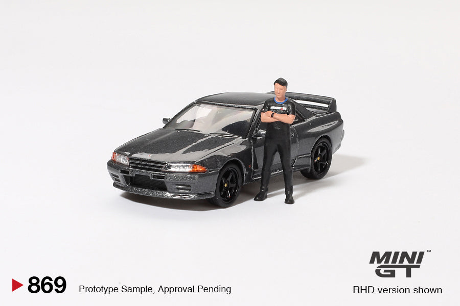 **PRE ORDER** Mini GT Nissan Skyline GT-R (R32) Nismo Gunmetal W/ Matsuda Figure Tsugio Matsuda Collection