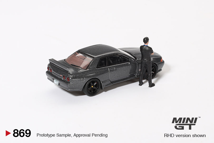 **PRE ORDER** Mini GT Nissan Skyline GT-R (R32) Nismo Gunmetal W/ Matsuda Figure Tsugio Matsuda Collection