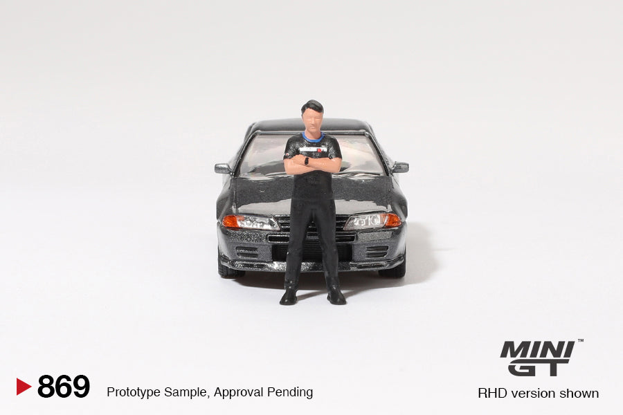**PRE ORDER** Mini GT Nissan Skyline GT-R (R32) Nismo Gunmetal W/ Matsuda Figure Tsugio Matsuda Collection