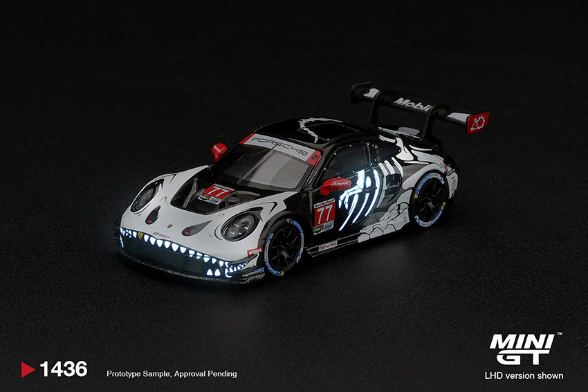 **PRE ORDER** Mini GT Porsche 911 GT3 R (992) #77 AO Racing "Skeleton Rexy" 2026 IMSA Petit Le Mans - MGT01436